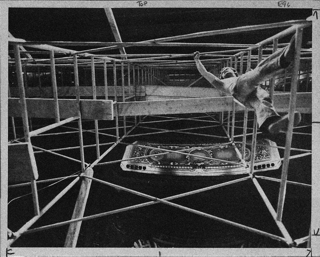 L. Curt Mangel, founder of the Friends of Shea's Buffalo and director of the restoration work on the Buffalo landmark, is seen from a straight up angle as he climbs over scaffolding to inspect a plastering job. The effort to restore the showplace to its former splendor, including new seats and rugs and refurbished marble and chandelier, is expected to be completed by Sept. 29.