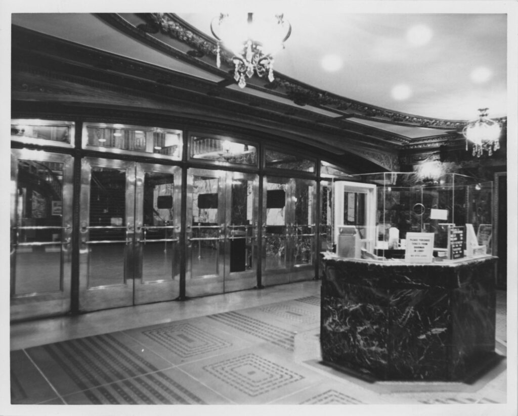 View of vestibule looking northwest. Marble ticket office is in the center foreground, bronze and glass doors in the background.
