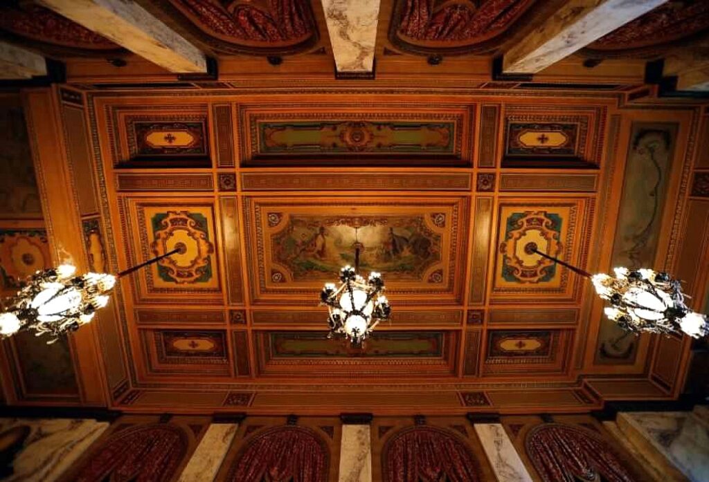 Above the chandeliers are trap doors that can be opened to crank the chandeliers all the way down to the ground for an annual cleaning - the last time was in 2016. Now, Shea's rents a special lift to help us clean the crystals and lights.