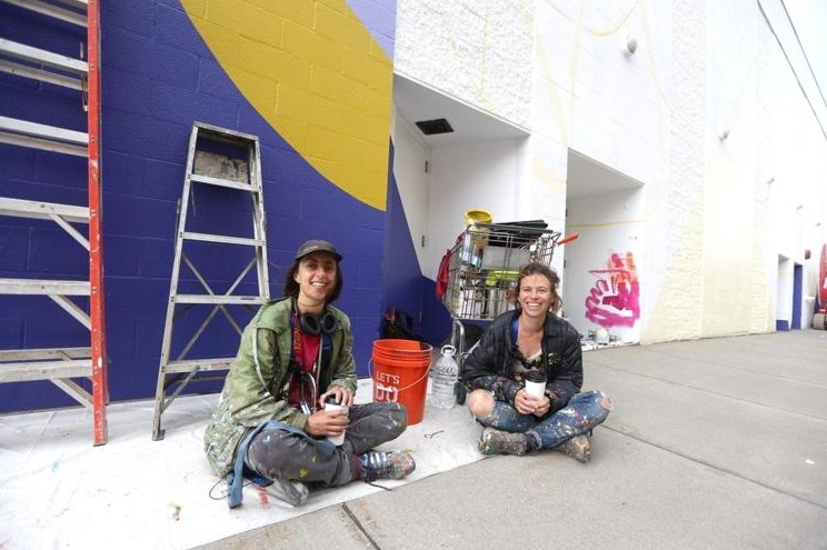 The AK Public Art Initiative commissioned this mural that appears on the side of the Shea's 710 Theatre, painted in the summer of 2016 by artists <a href="https://www.jessieandkatey.com/">Jessie and Katey</a>